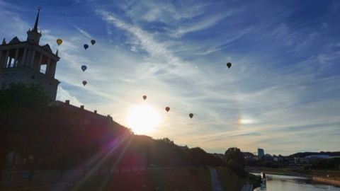 Hot air balloons over Vilnius at sunset